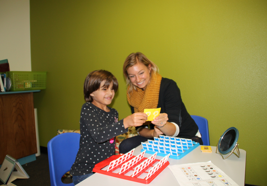 Woman and Girl playing a game Children's Speech & Reading Center