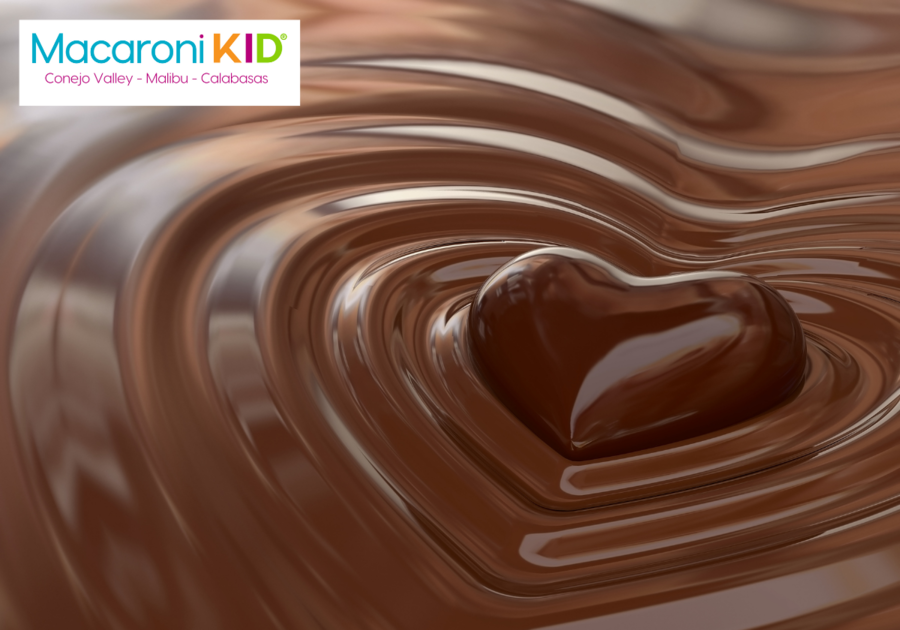 Chocolate heart in chocolate surrounded by heart shaped ripples