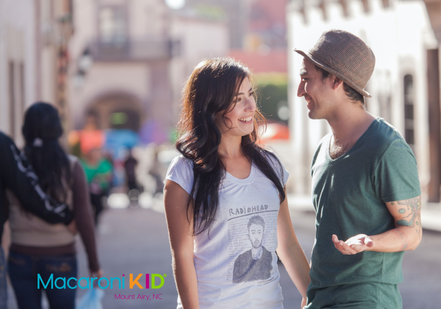 couple on a street smiling