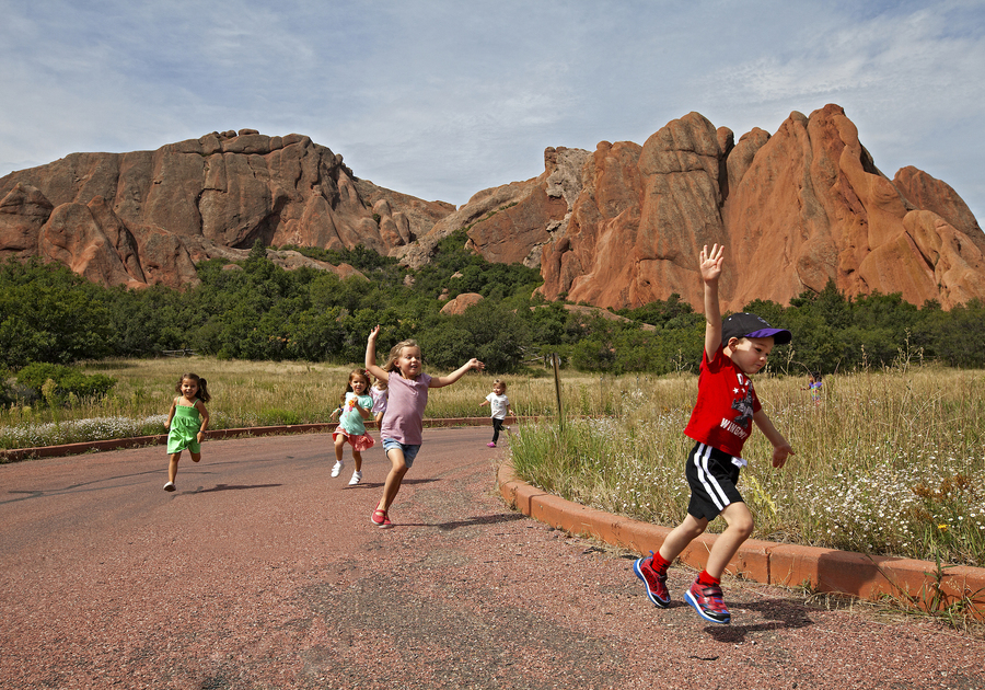 children running along a path at roxborough state park