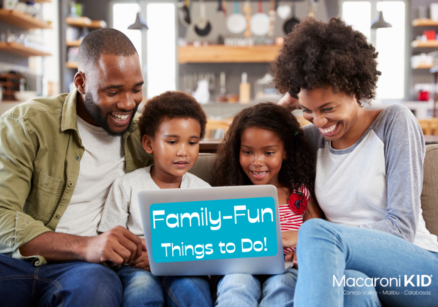 family on the sofa looking at a laptop