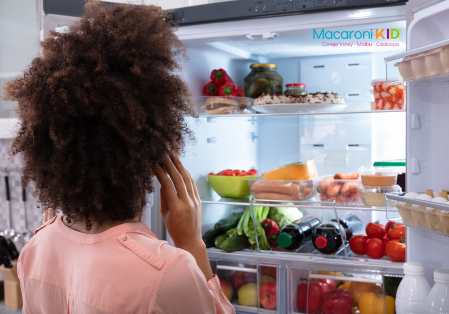 Woman searching in fridge