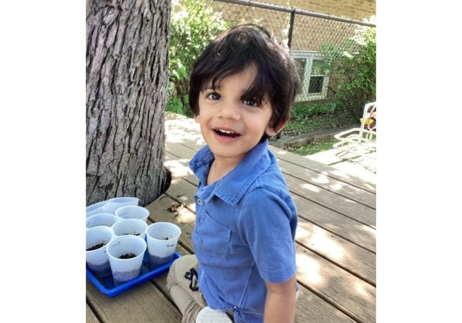 little boy gardening