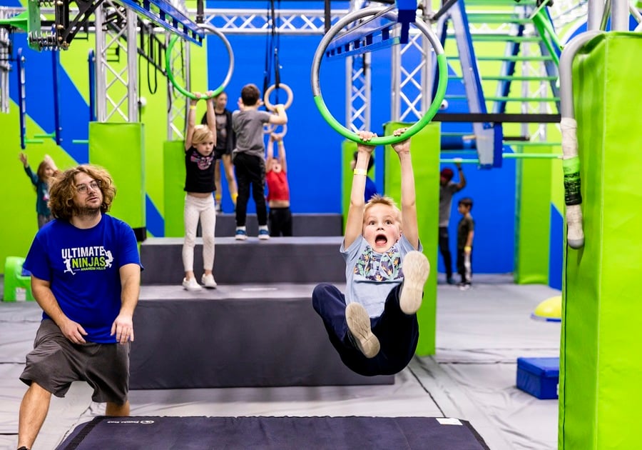 kid swinging on ring