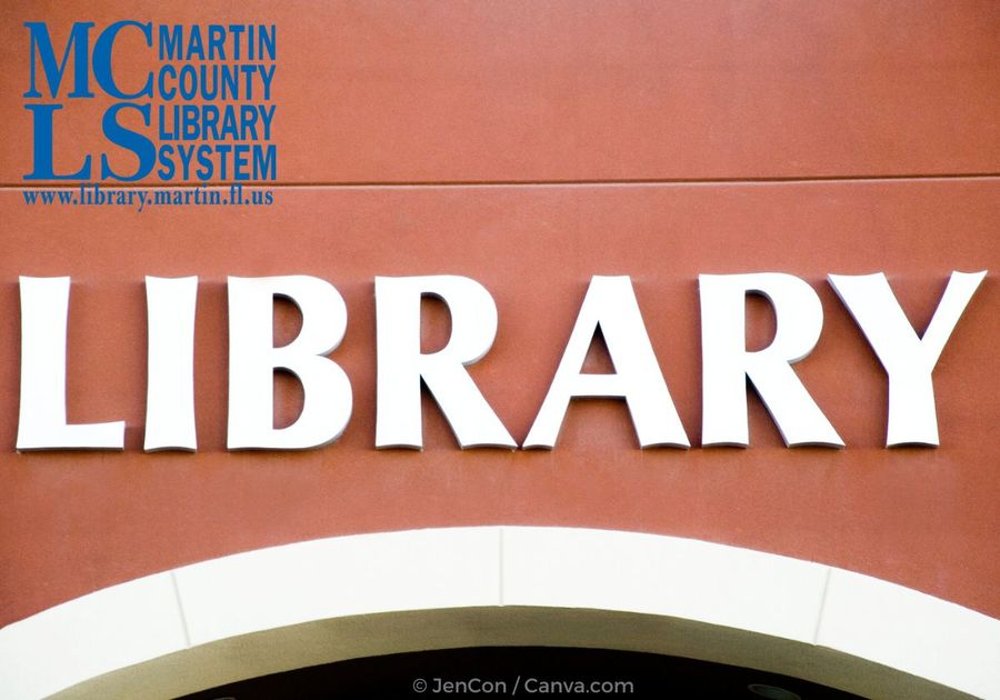 Library written in white letters on a building over an arch