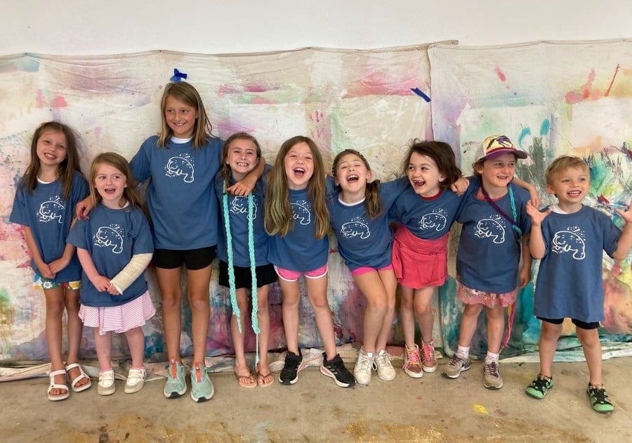 photo of campers lined up wearing camp shirts