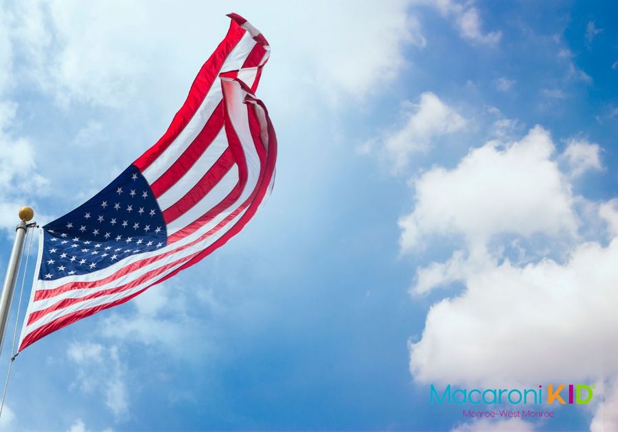 American Flag commemorating a national holiday, veterens day, independence day, blue sky background.