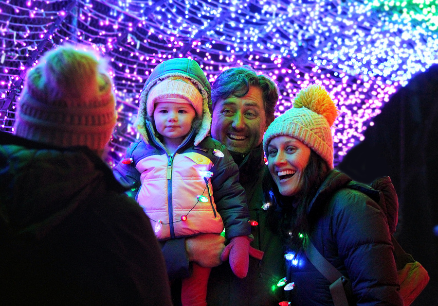 family in light tunnel