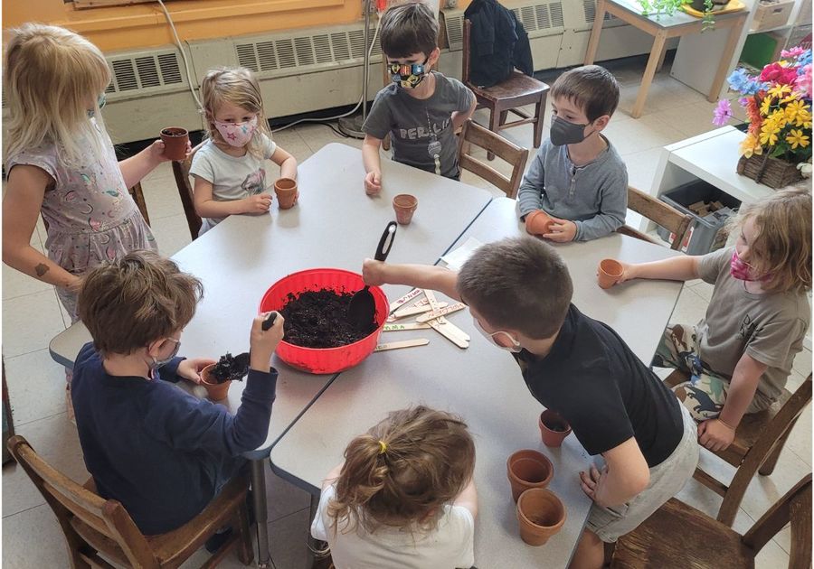 kids planting in classroom