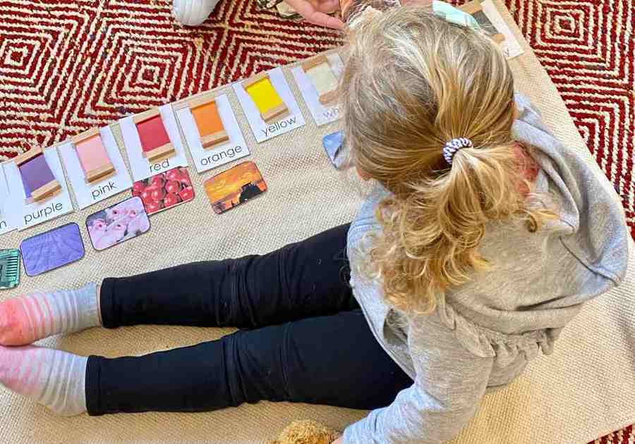 little girl organizing colors