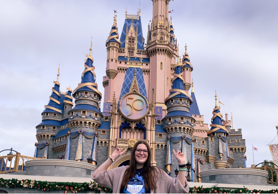 Woman in front of Disney castle