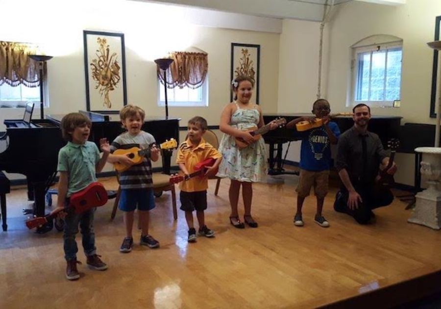children play ukulele during berkshire music school class