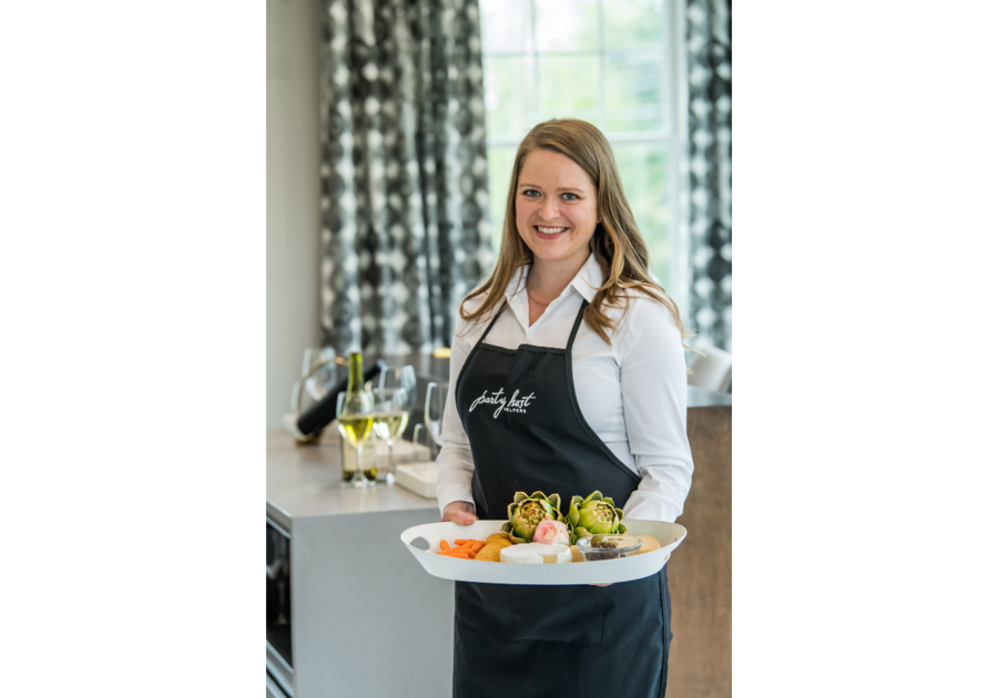woman in apron with veggie tray