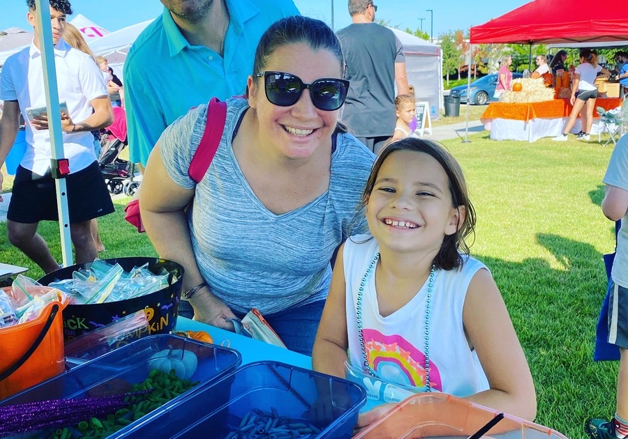 Family at Macaroni Kid Booth