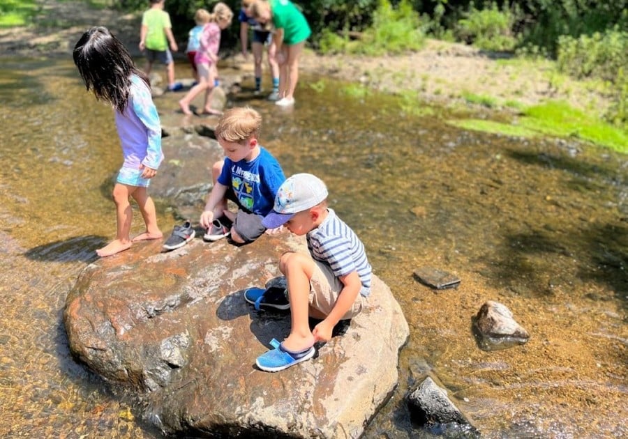 Kids playing in the stream at Newlin Grist Mill