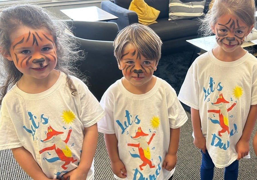 Photo of young campers in camp tshirts with face paint