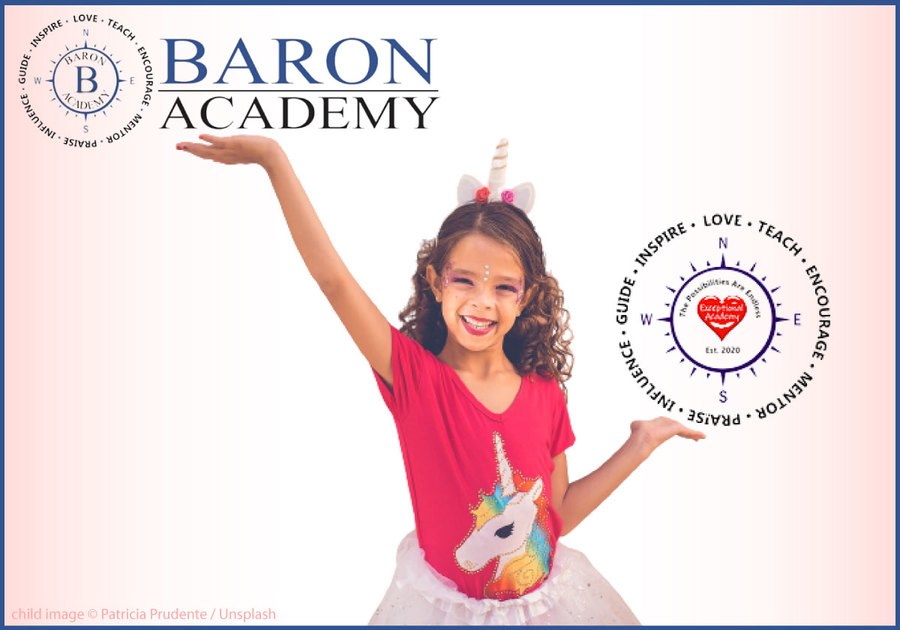 Cute child holding up Baron Academy and Exceptional Academy logos