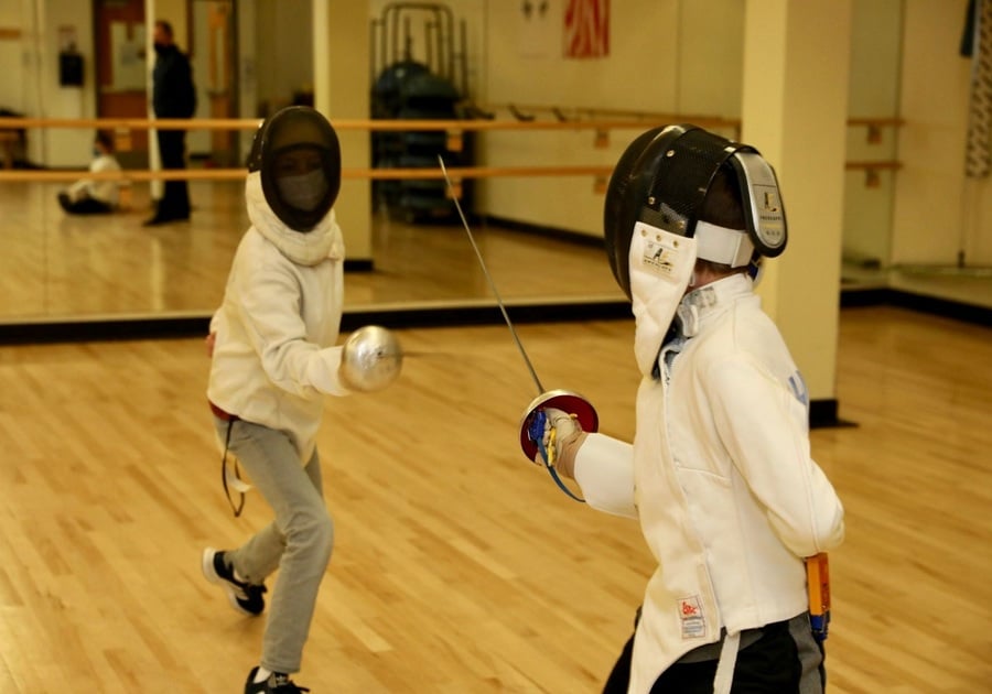 two children learning to fence at an HRCA Sports Camp