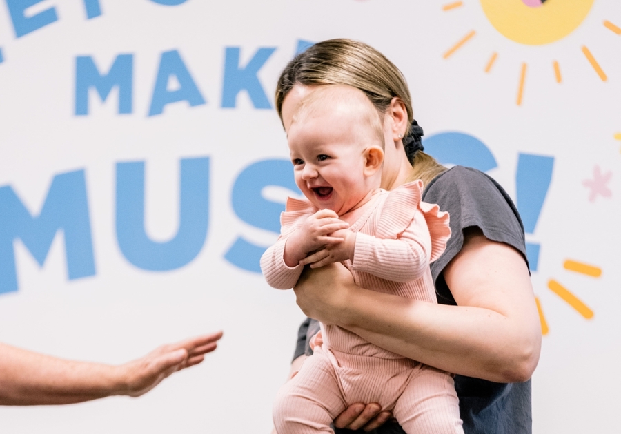 woman holding smiling baby