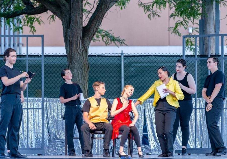 teens performing a play outside