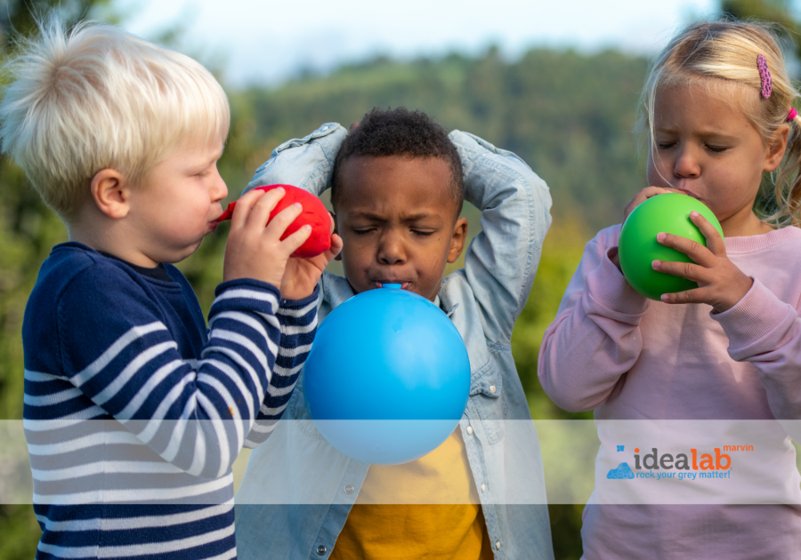 kids struggle to blow up balloons