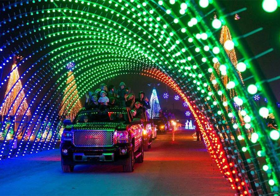Driving through holiday light tunnel in dark