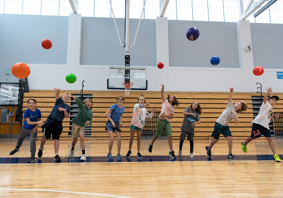 children throwing balls at Denver Academy Summer Camp