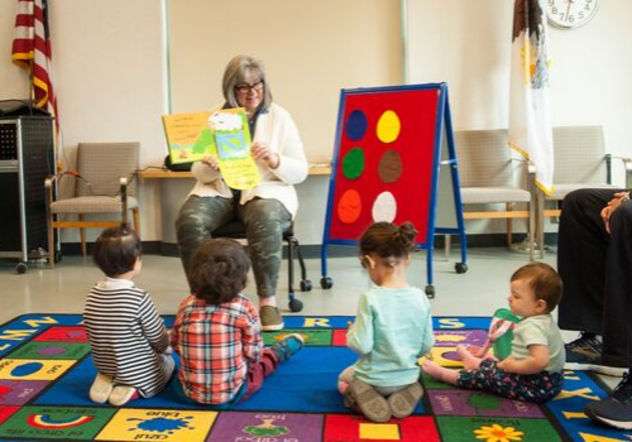 woman reading to kids