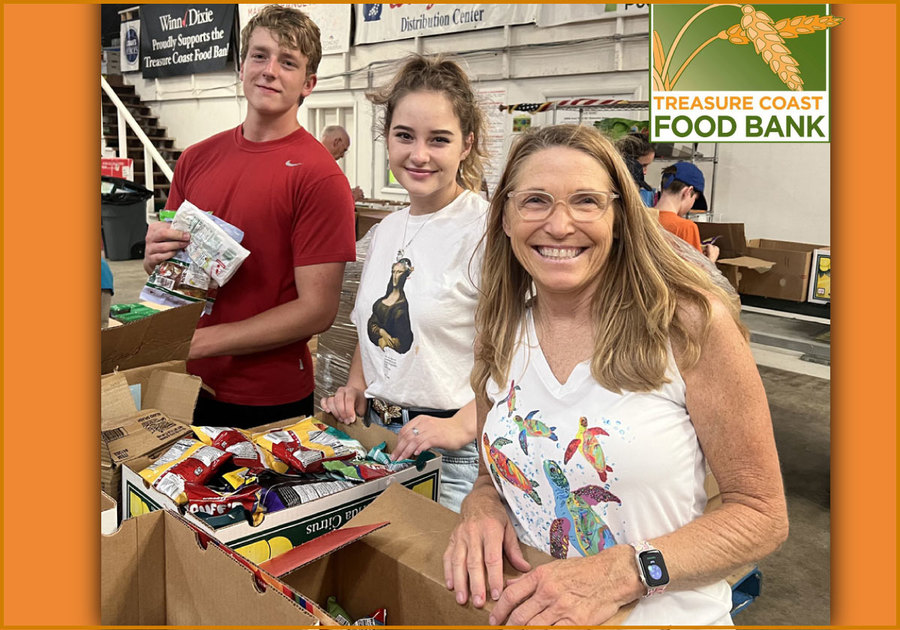 Volunteers from the First United Methodist Church help pack food for neighbors in need.