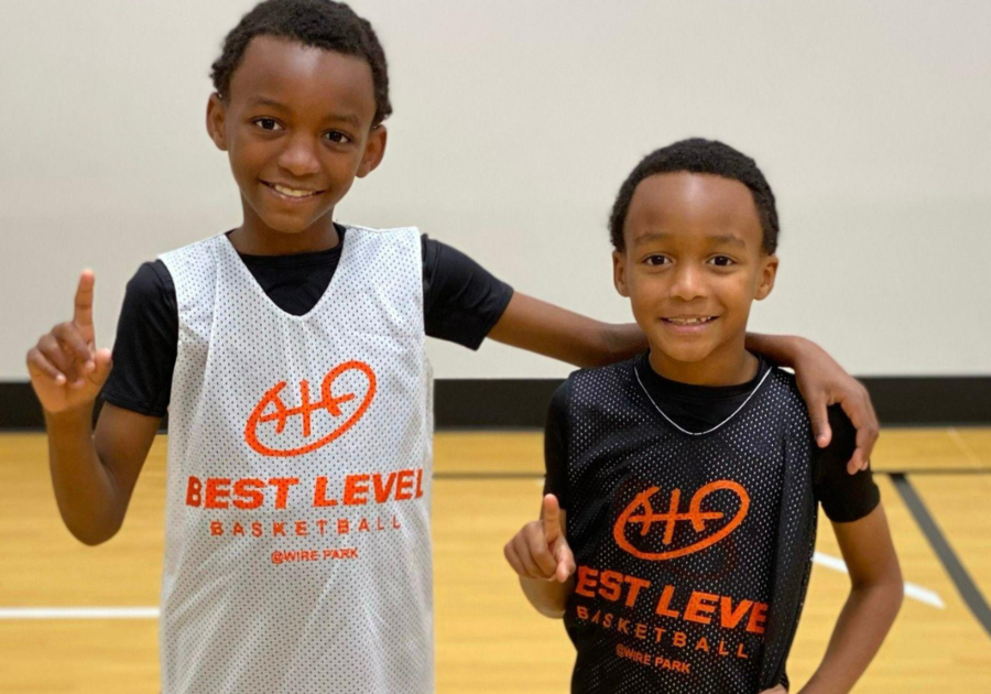 Photo of two young boys in Best Level basketball jerseys standing together