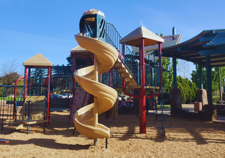 Tall play structure with twisty slide designed for older children at Wildwood Park