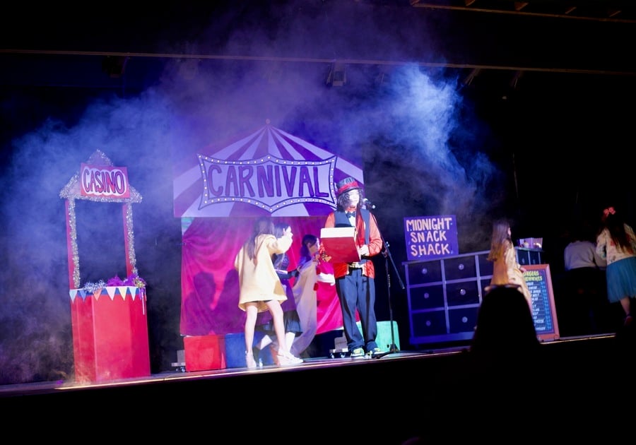 photo of teenagers performing on stage