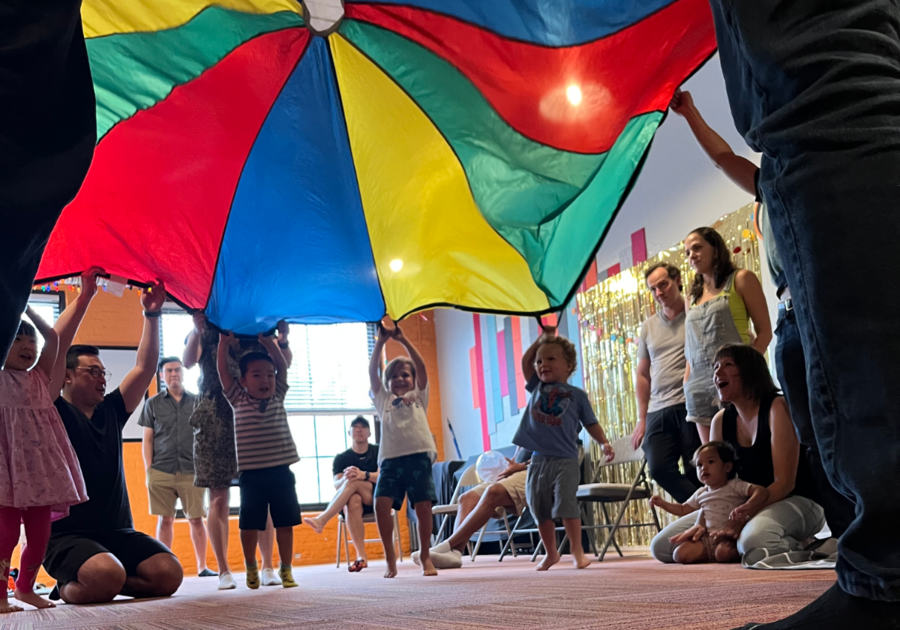 kids playing with parachute at a party