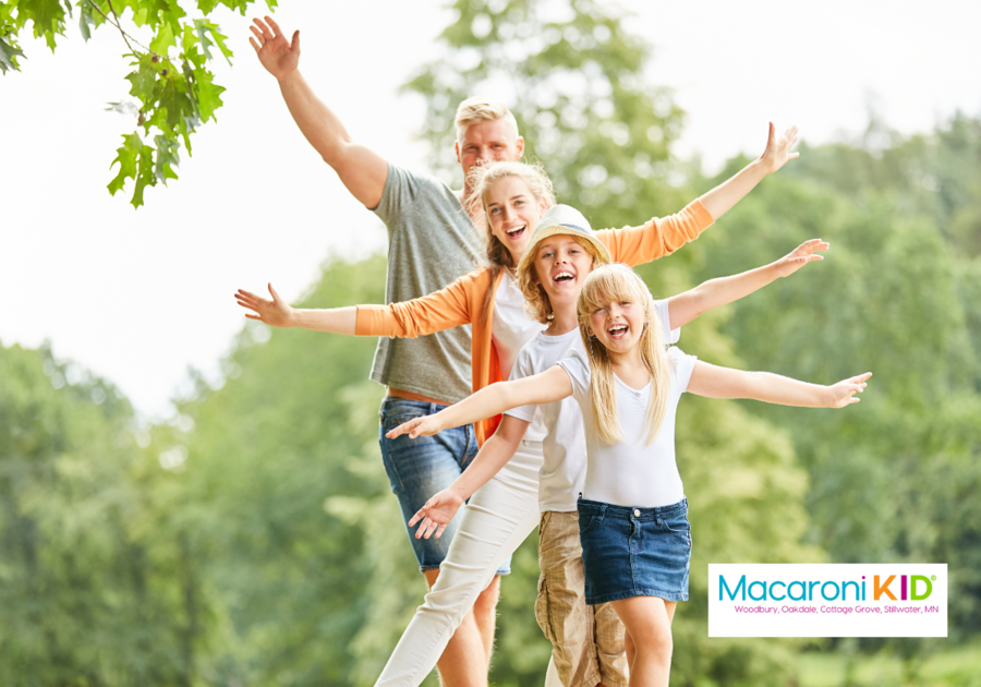 Family walking on a balance beam outside