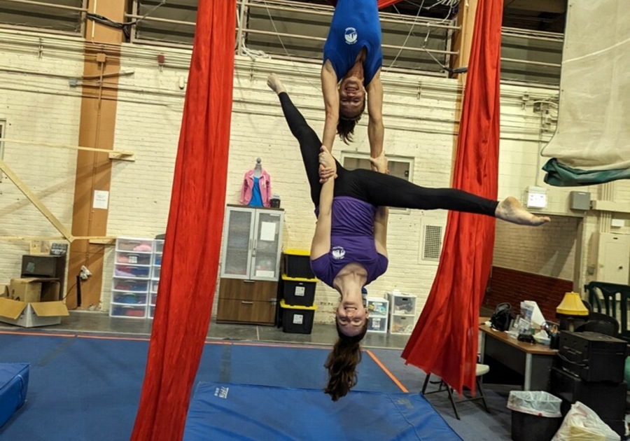 two people on circus silks
