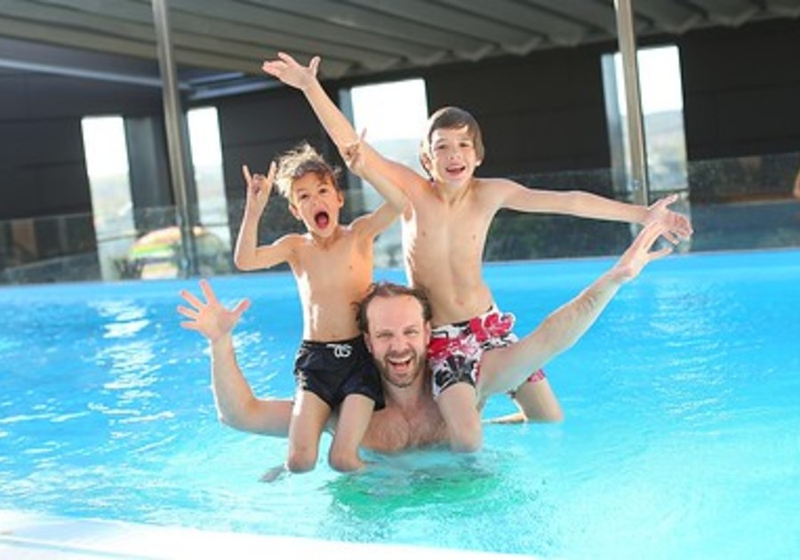 Dad with kids in pool