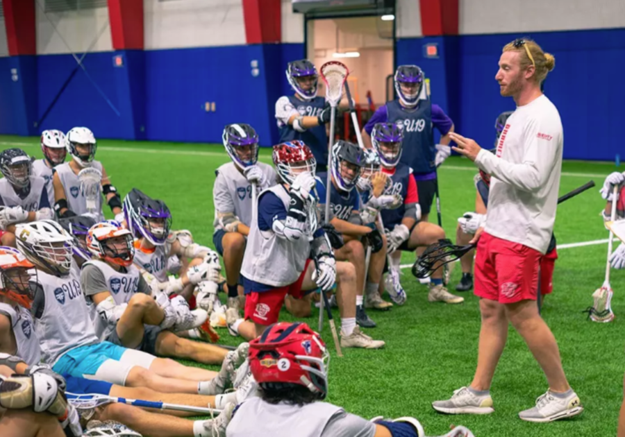Lacrosse coach speaking to players