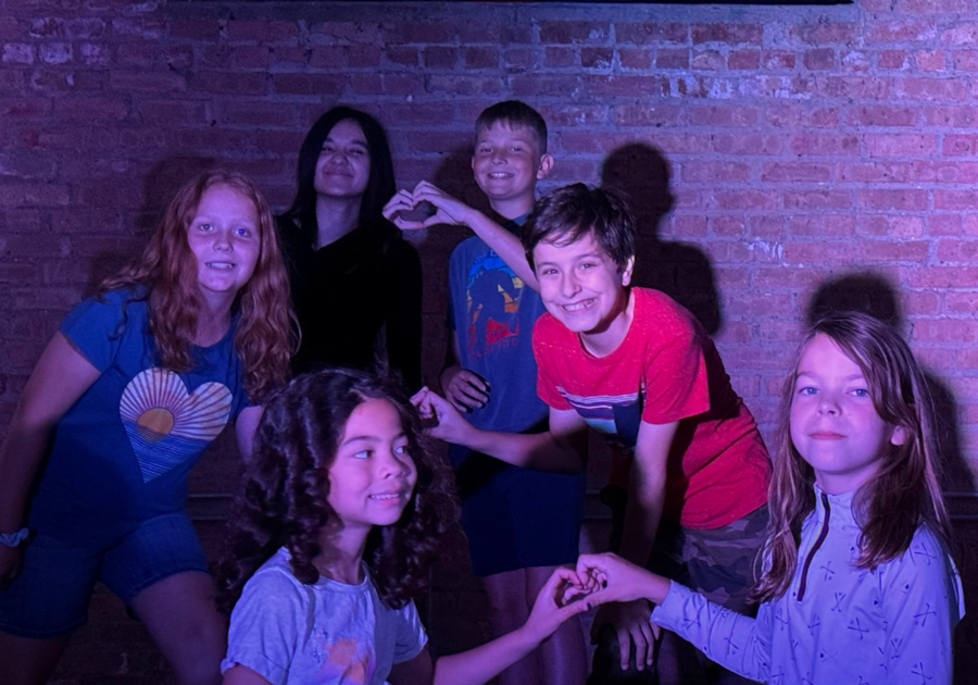 group of kids in blacklight