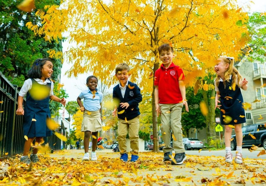 kids playing in leaves