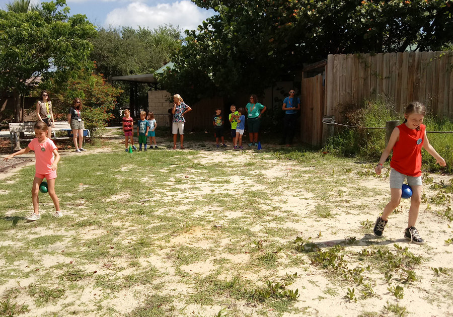 2024 Hobe Sound Nature Center Summer Camp students playing games outdoors