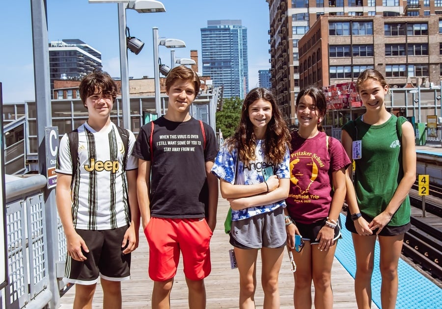 5 teens at a CTA station platform