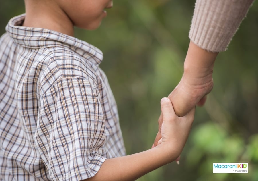 Mother and son holding hands