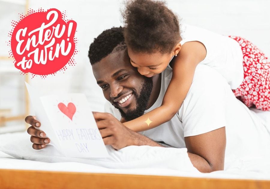 Little black girl celebrating Father's Day with daddy.