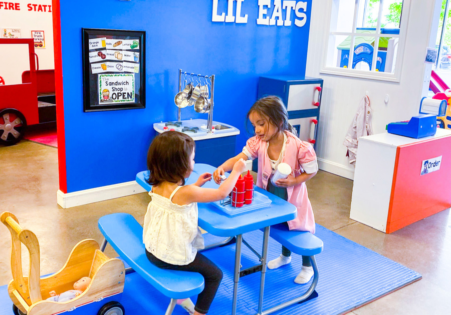 children engaging in imaginative play in Lil Eats section at Kids Wonder in Centennial