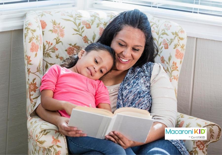 Hispanic mother reading to little girl