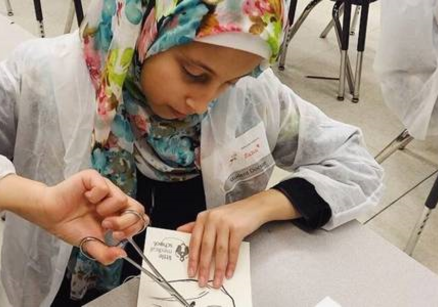 Young girl practicing to be a sports doctor in a Little Medical School Sports Medicine School After-School Program