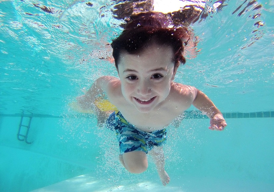 Boy underwater in pool