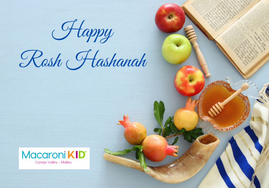 Happy Rosh Hashanah on a light blue background with apples pomegranates, honey, tallit, shofar and prayer book