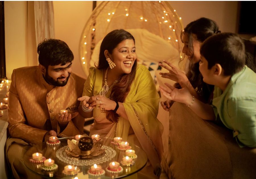 Family with Lighted Candles Celebrating Diwali at Home View by Jacob Varghese from Studio India 