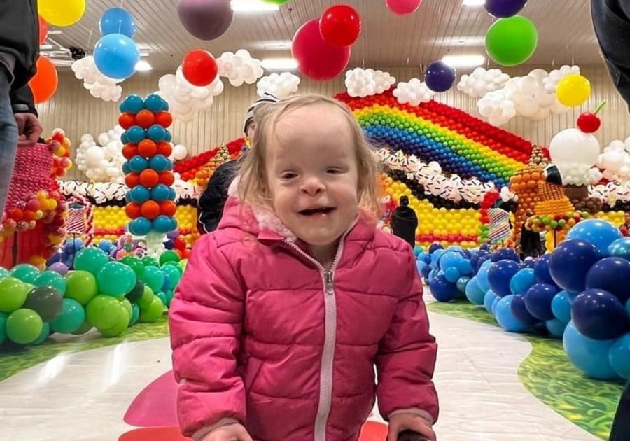 Smiling Kiddo rainbow balloon background Life Stories